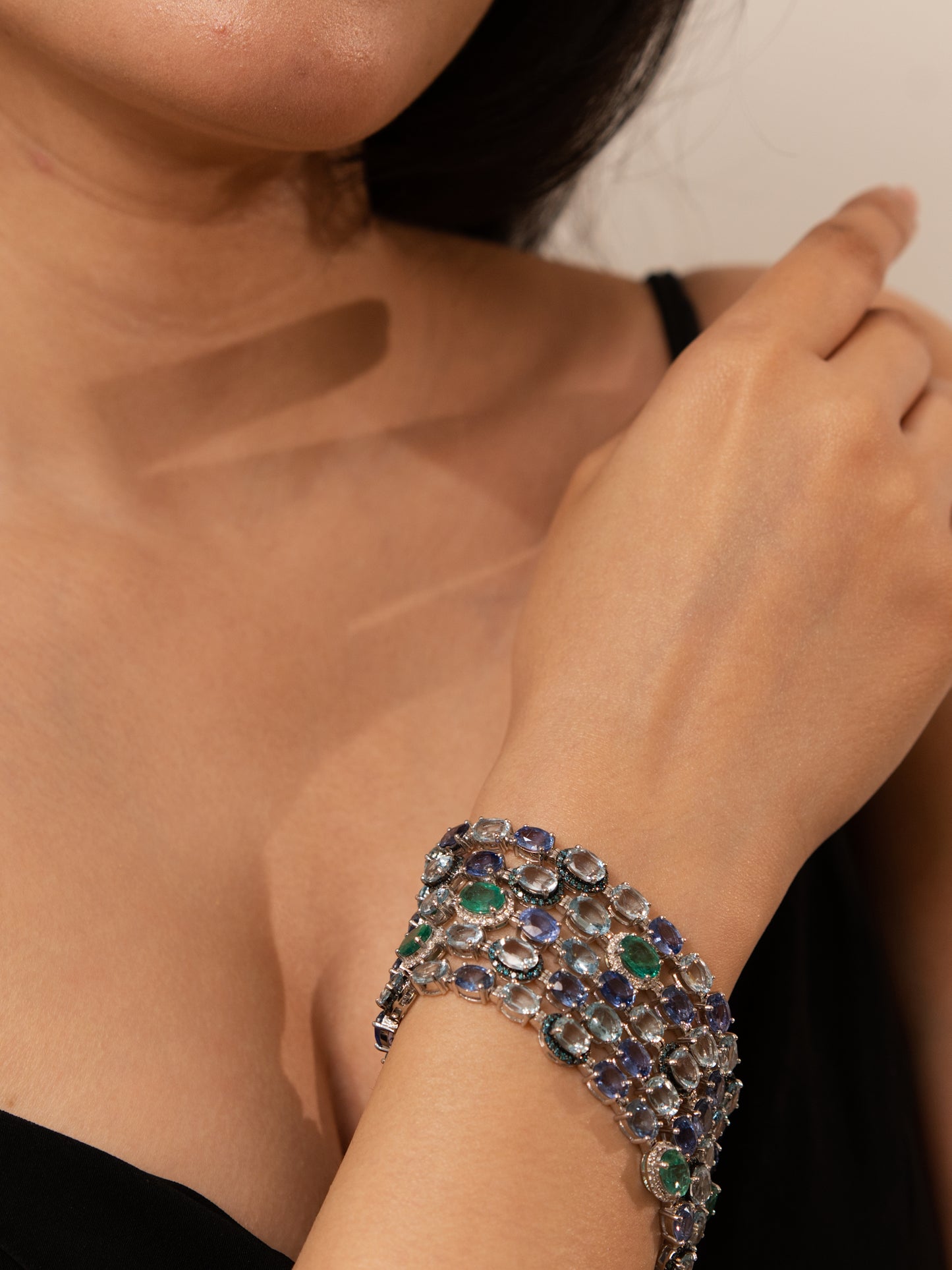 18K Gold Designer 5 row Bracelet featuring Aquamarine, Sapphire and Emerald