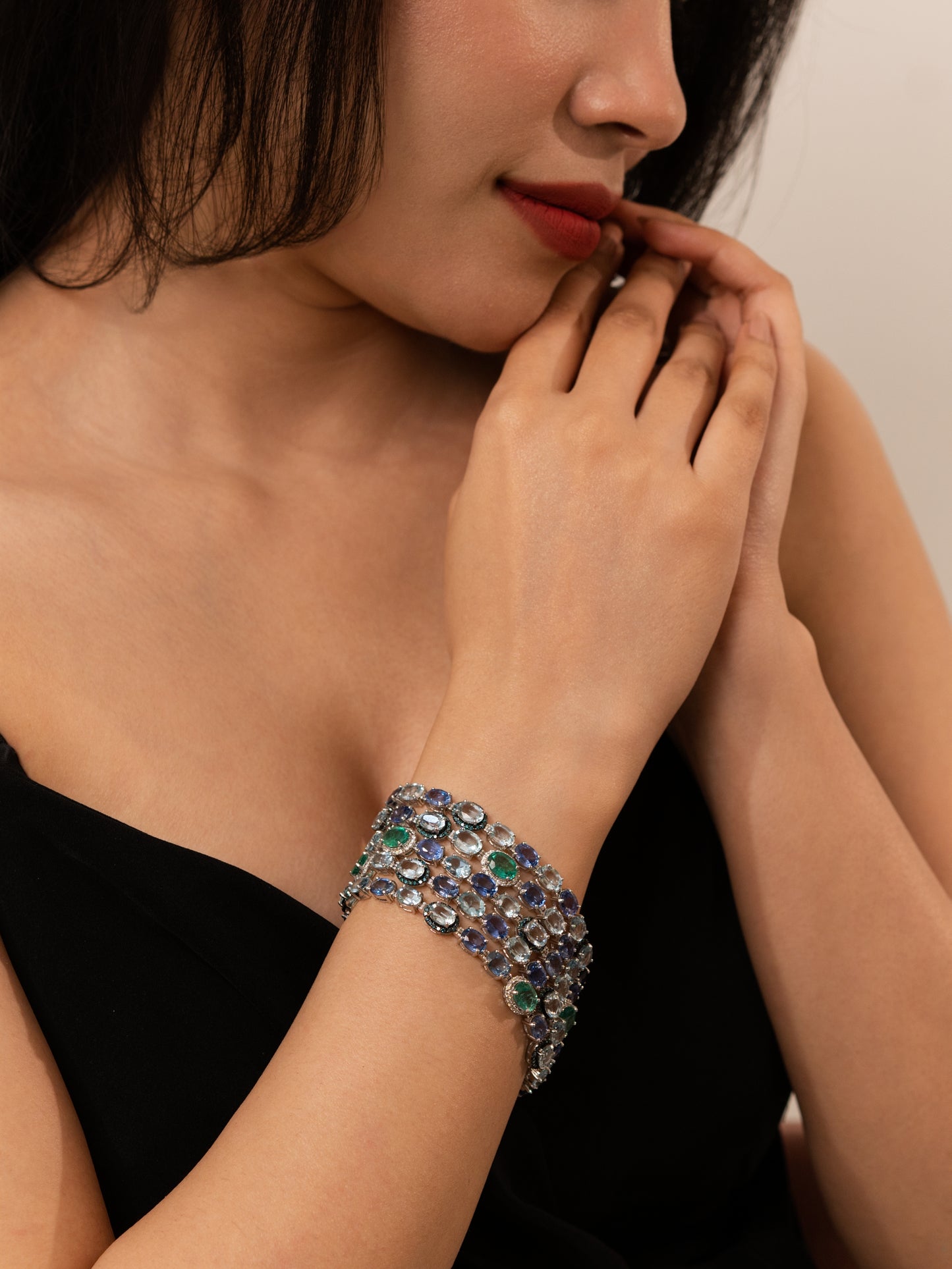 18K Gold Designer 5 row Bracelet featuring Aquamarine, Sapphire and Emerald