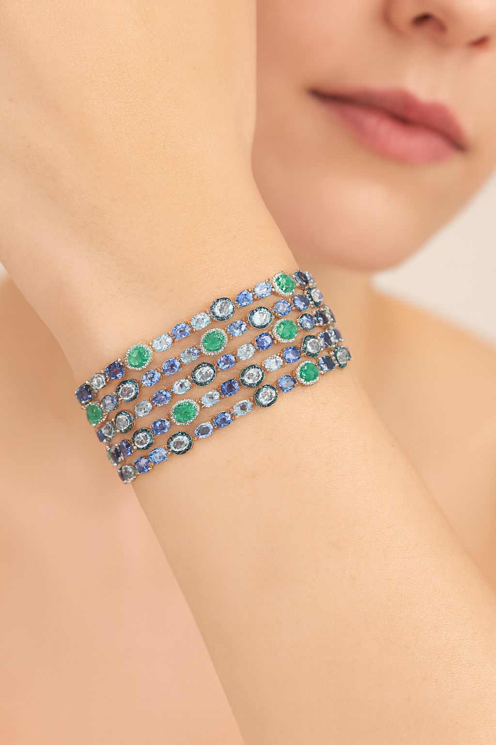 18K Gold Designer 5 row Bracelet featuring Aquamarine, Sapphire and Emerald