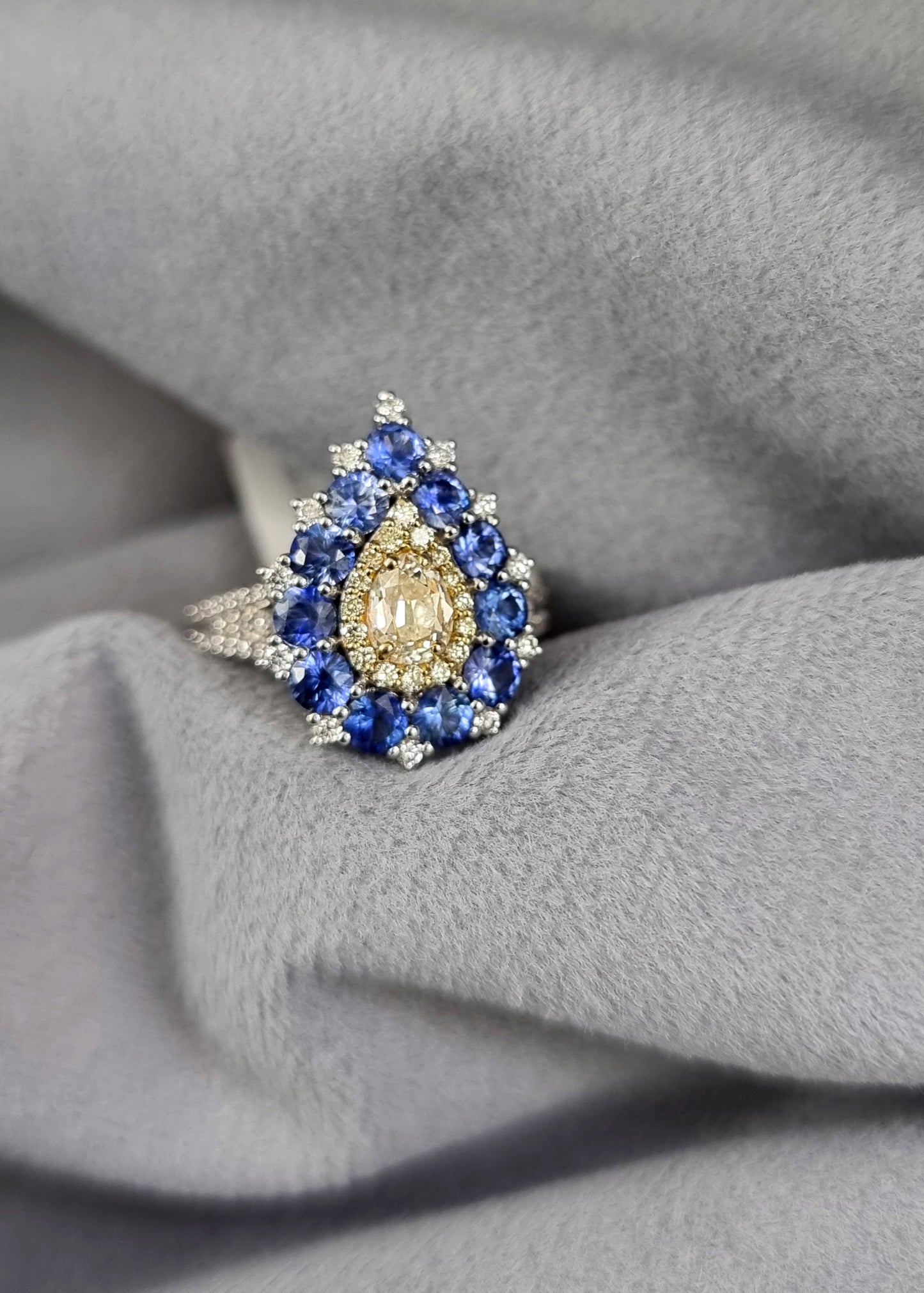 1.17 ct Pear Sapphire with White, Canary and Yellow Diamond Ring in 18K Gold