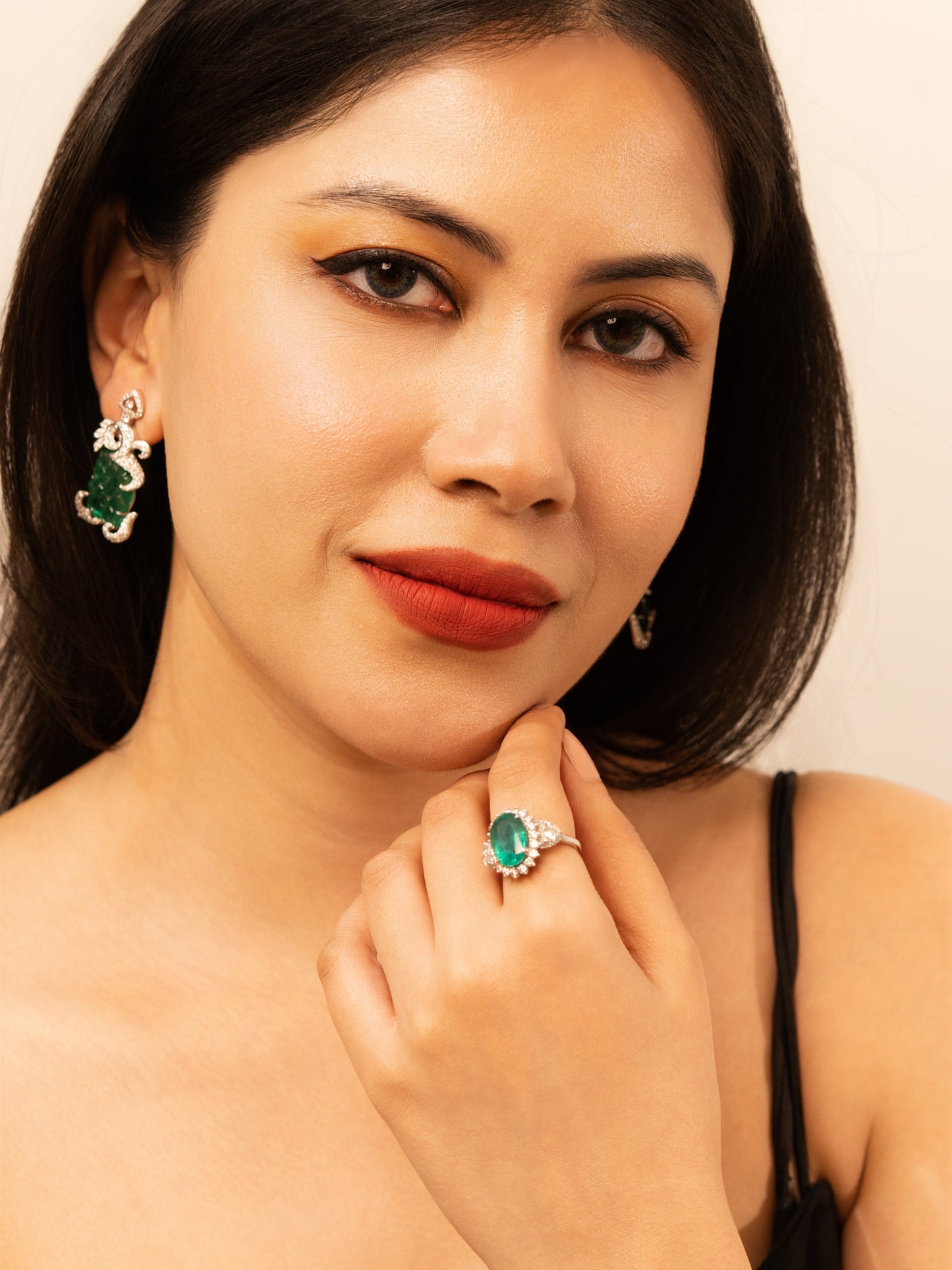 1.63 ct Oval Emerald with White and Trillion Diamond Ring in 18K Gold