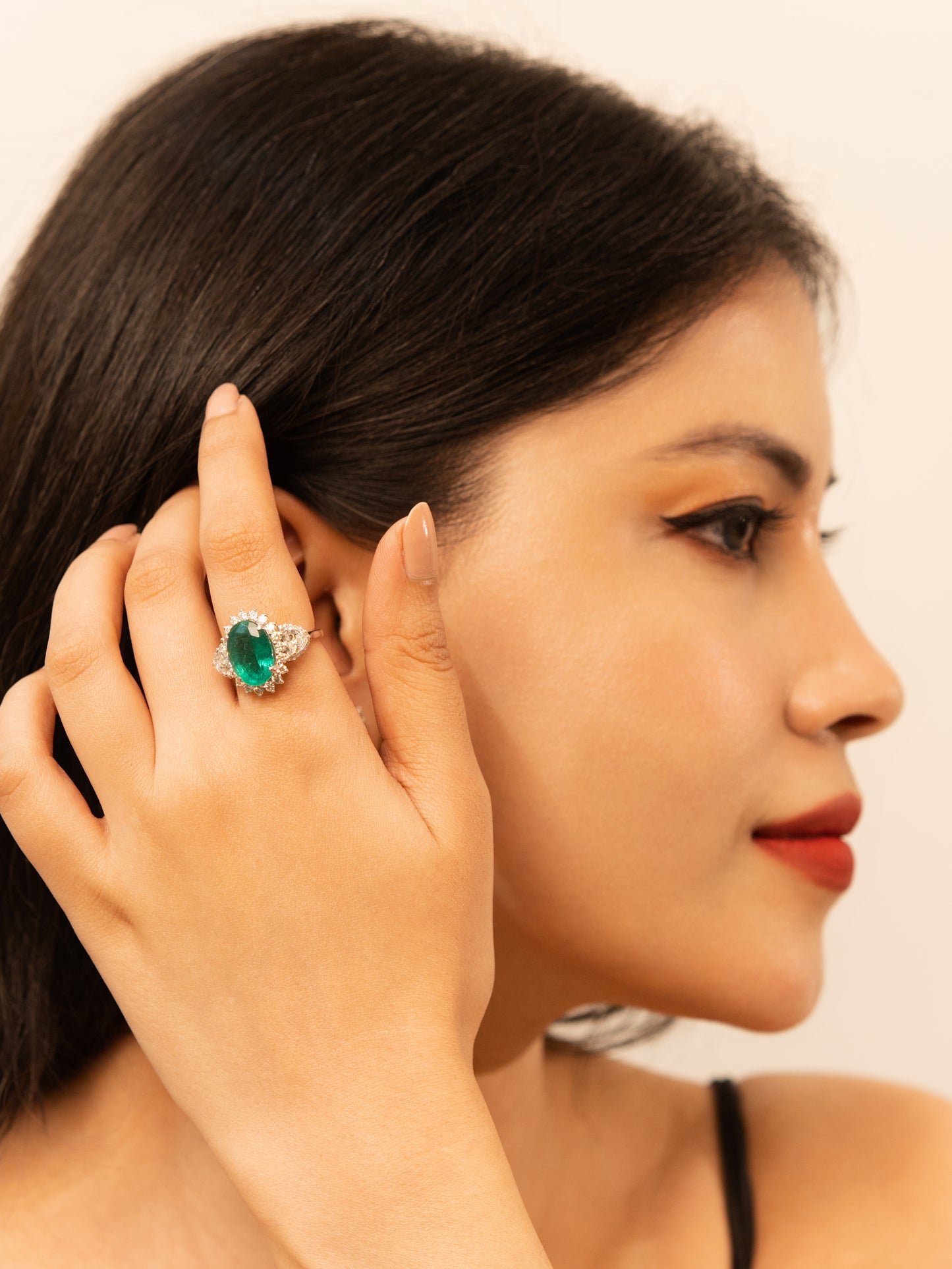 1.63 ct Oval Emerald with White and Trillion Diamond Ring in 18K Gold