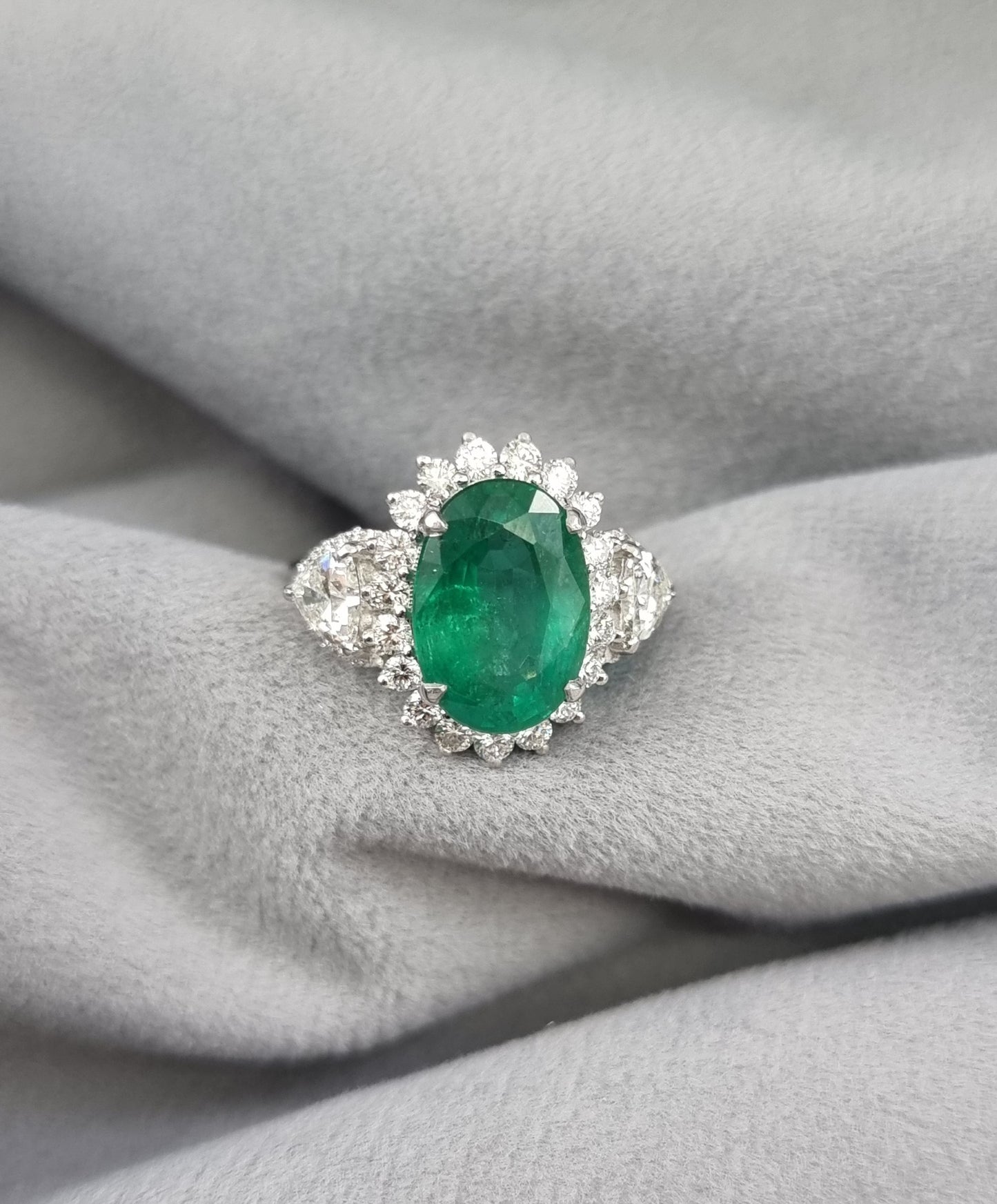 1.63 ct Oval Emerald with White and Trillion Diamond Ring in 18K Gold