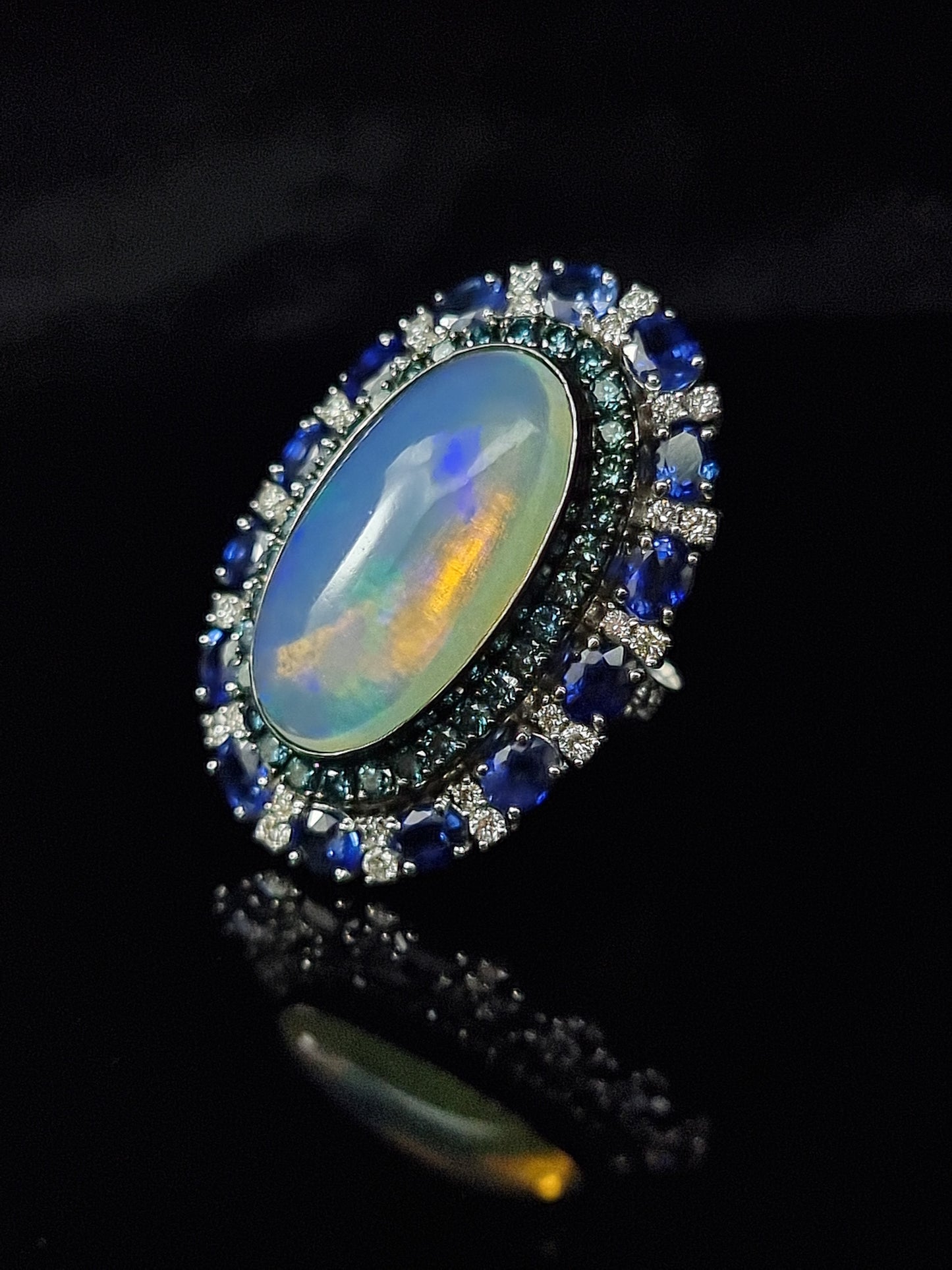 1.74 ct Oval Opal with Sapphire and White Blue Diamond Ring in 18K Gold