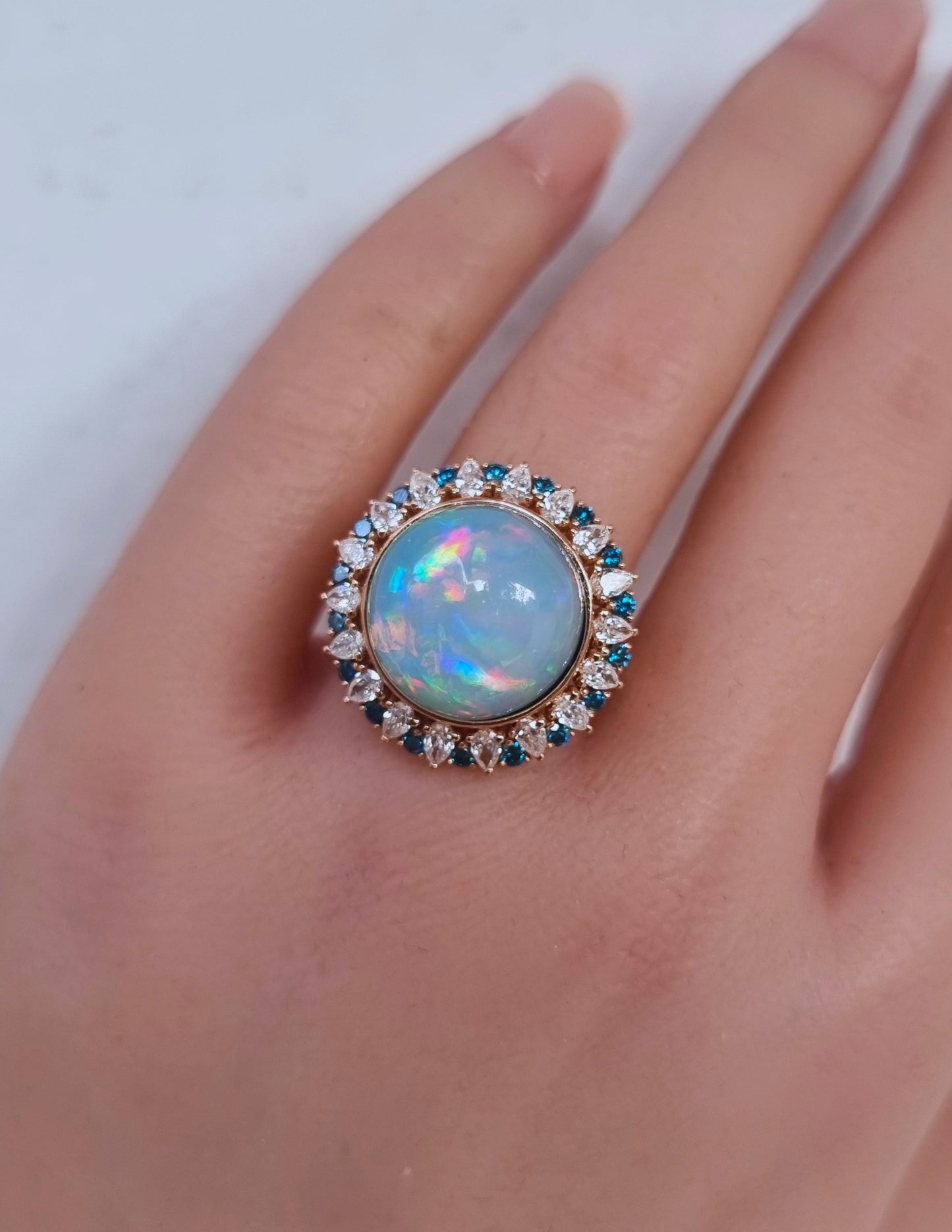 1.37 ct Round Opal with White and Blue Diamond Ring in 18K Gold