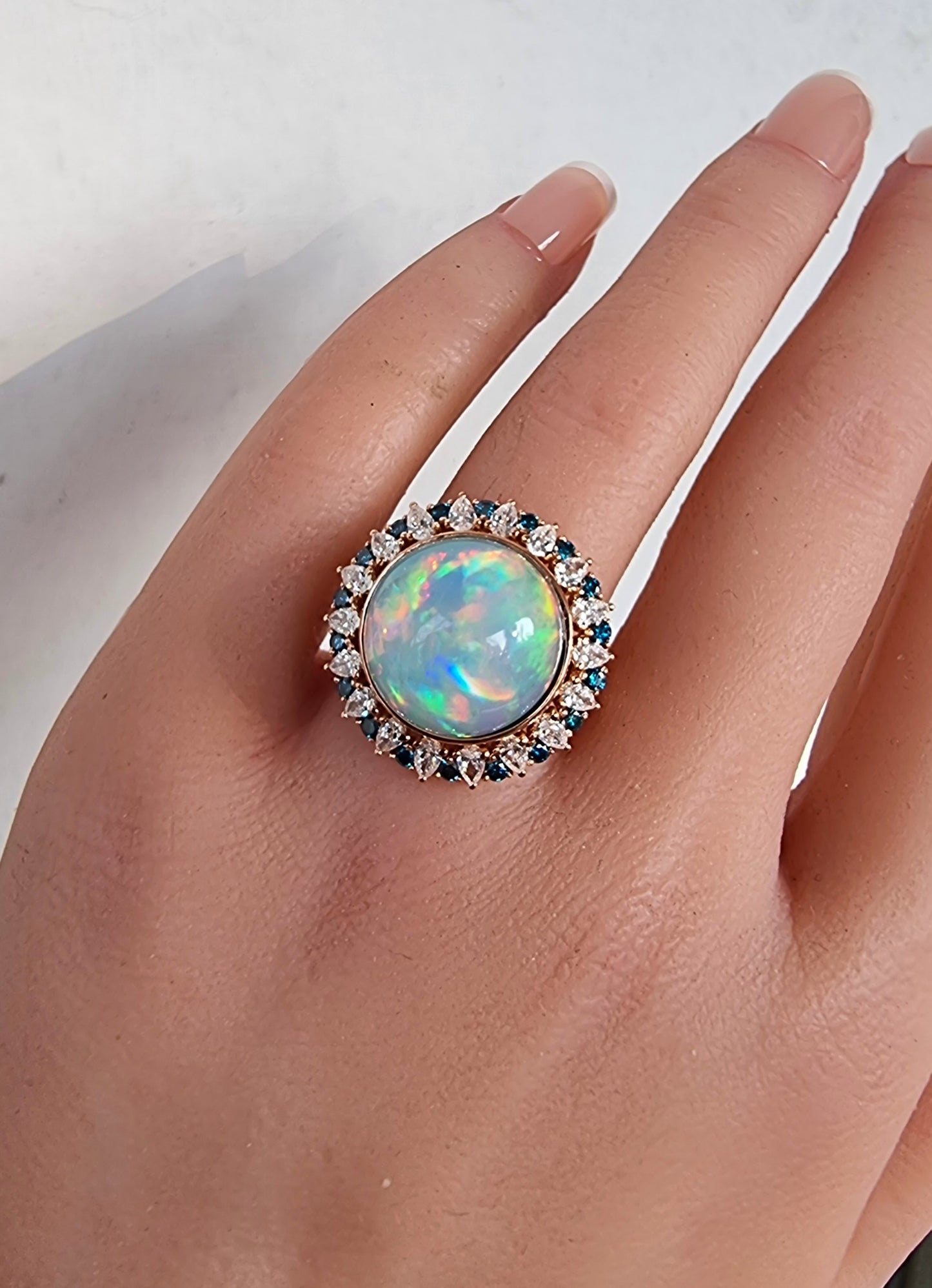 1.37 ct Round Opal with White and Blue Diamond Ring in 18K Gold